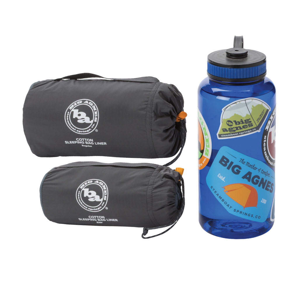 Two rolled-up Big Agnes Cotton Sleeping Bag Liners in gray are placed beside a blue water bottle with vibrant outdoor-themed stickers—ideal companions for your next adventure.