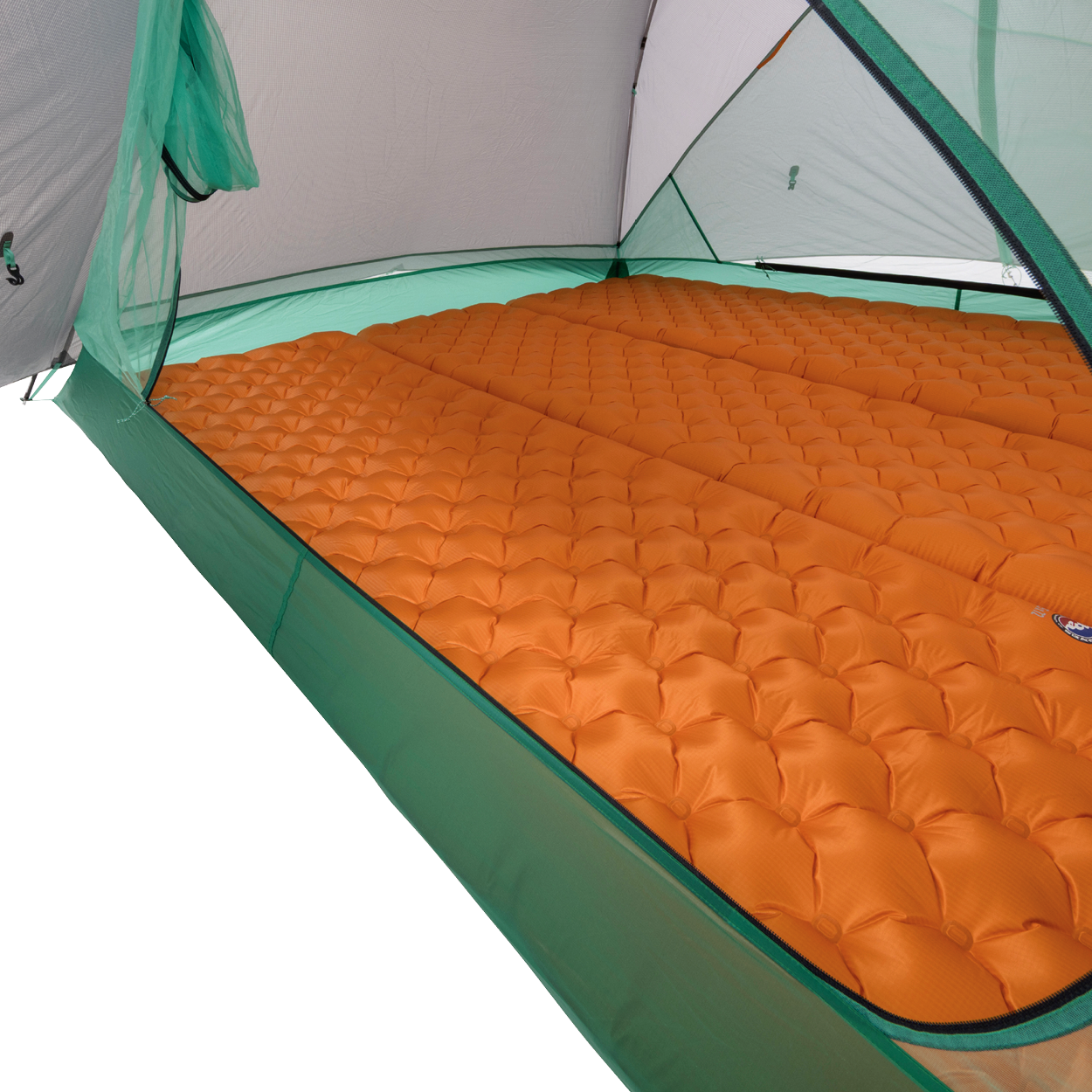 Two orange inflatable sleeping pads are laid out side by side inside a Big Agnes Sarvis VST 3 tent, covering the floor. Mesh sides and poles peek through, highlighting a cozy setup within this ultralight shelter.