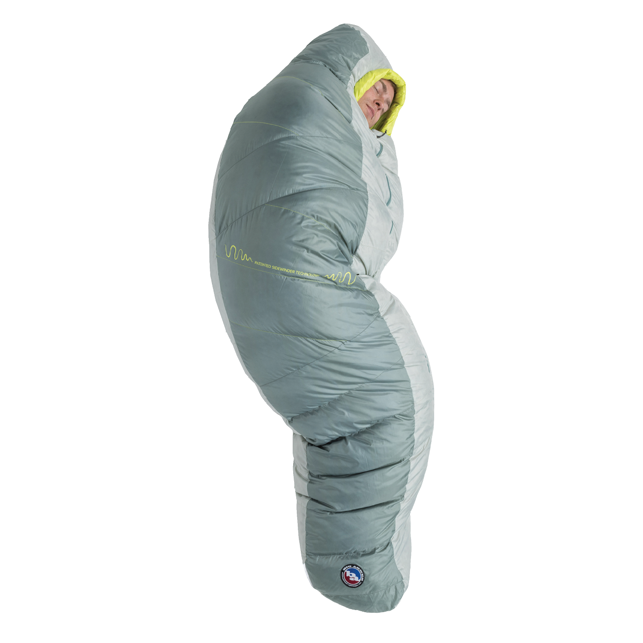 A person stands upright, fully zipped inside the Big Agnes Sidewinder 0˚ sleeping bag in gray and light green, featuring body-mapped insulation with only their face visible.