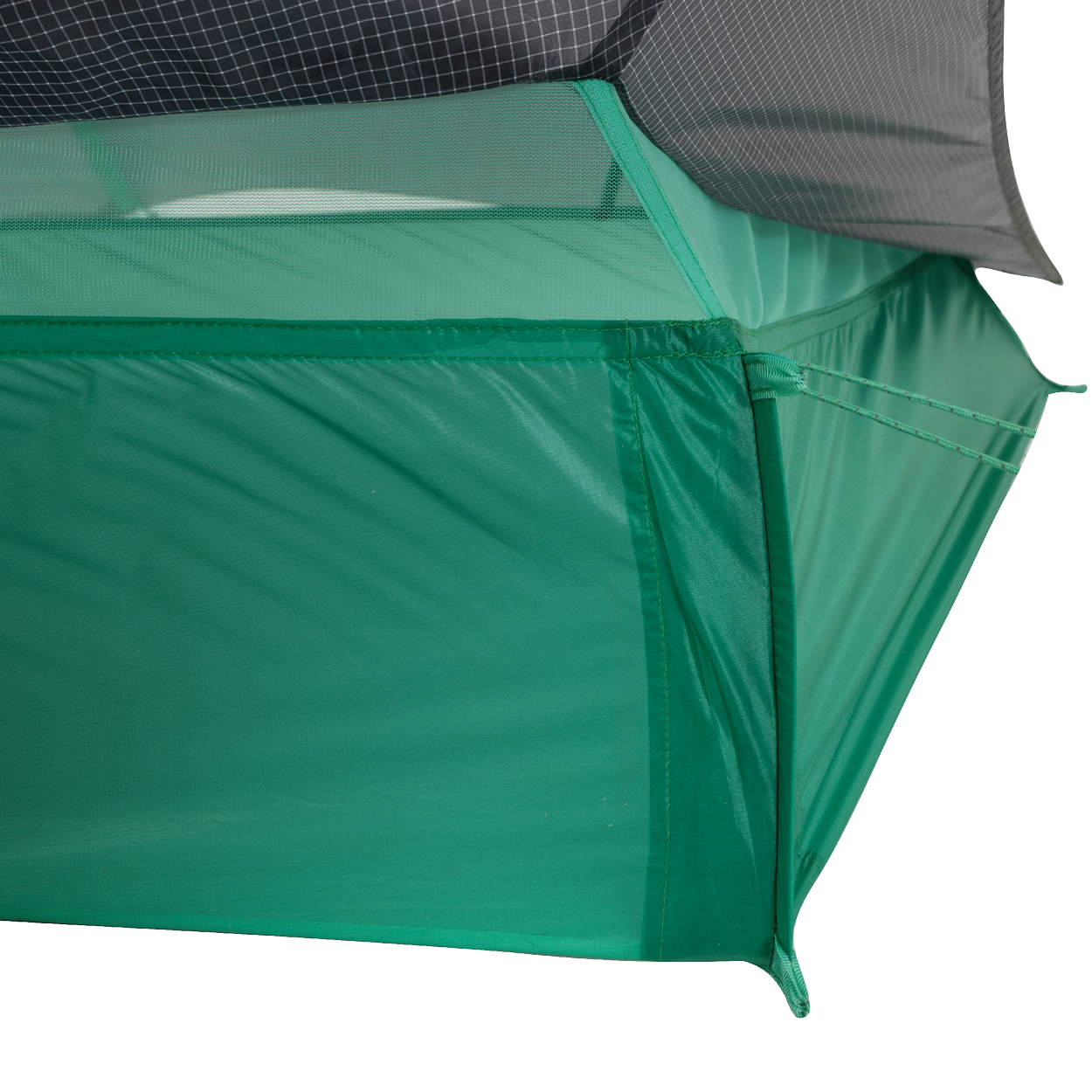 Close-up of the corner of the Big Agnes String Ridge VST 1.5 tent, an ultralight shelter featuring mesh upper panels, solid green lower fabric, and precise stitching that showcases its quality construction.